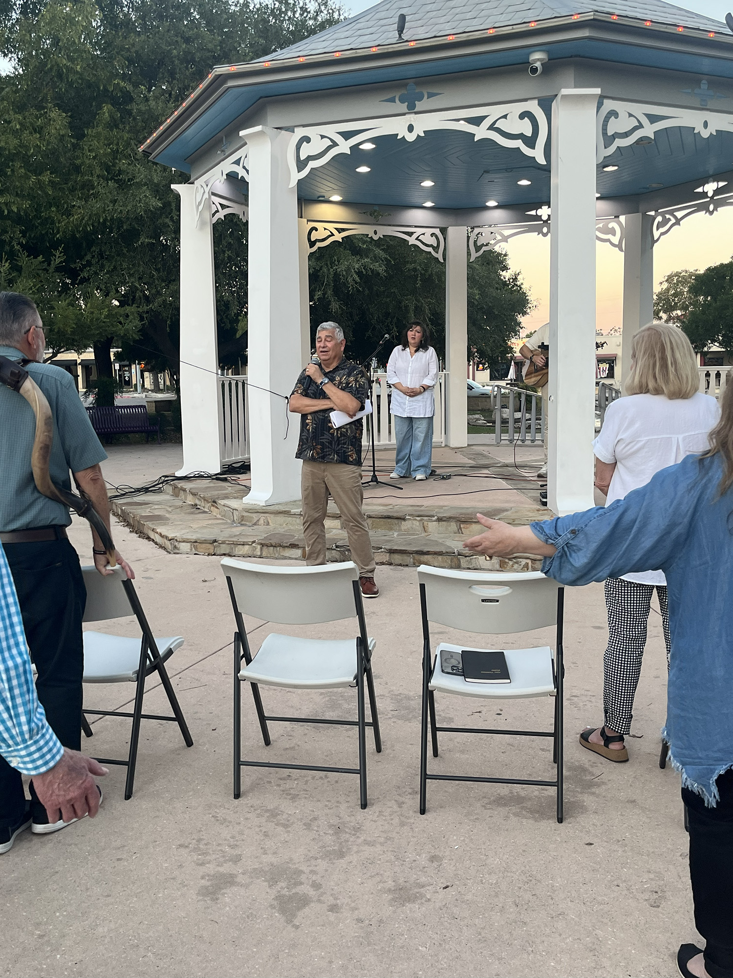 Pastor Ruben Mendez opens in prayer