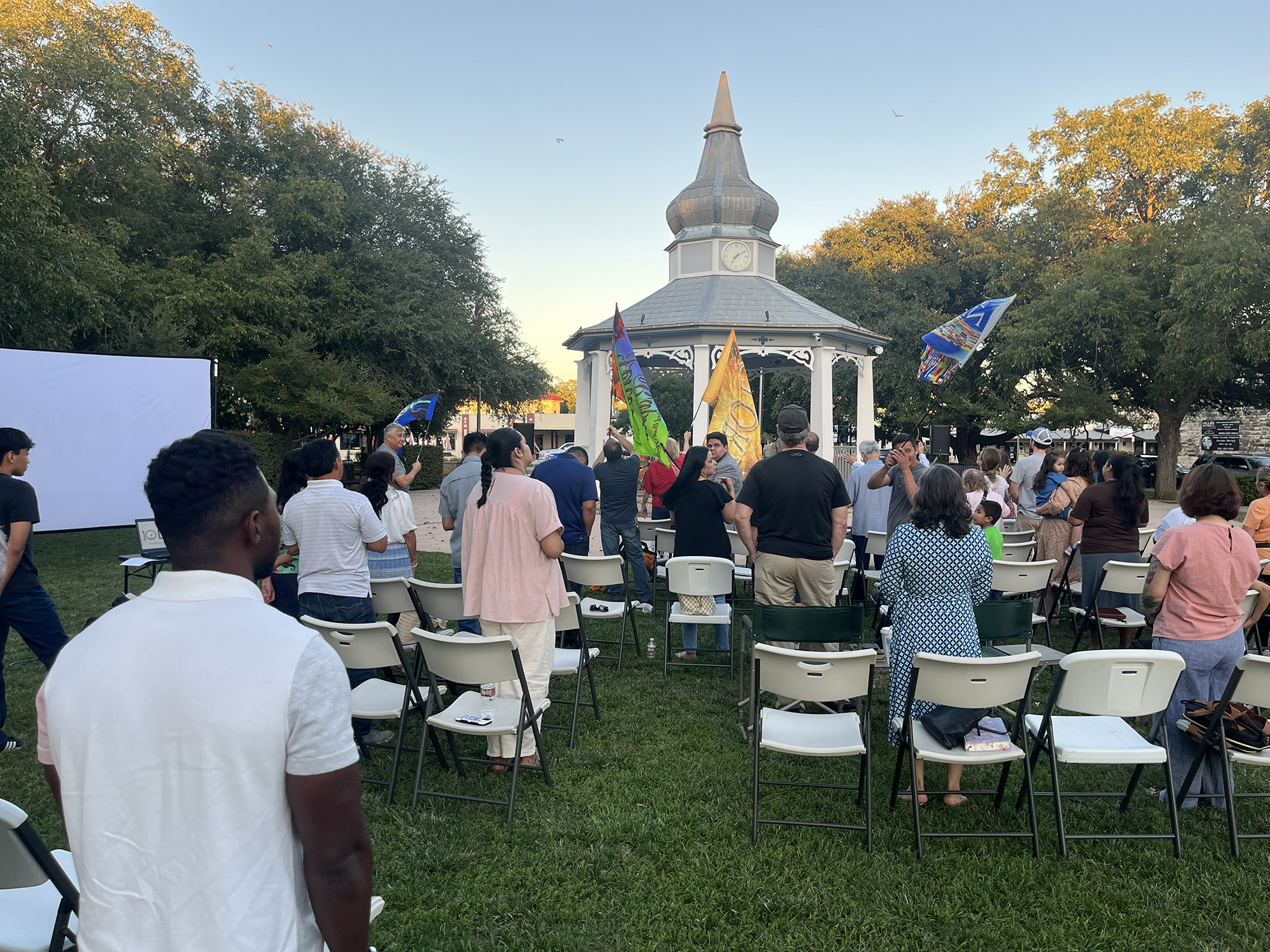 Attendees rise to sing
