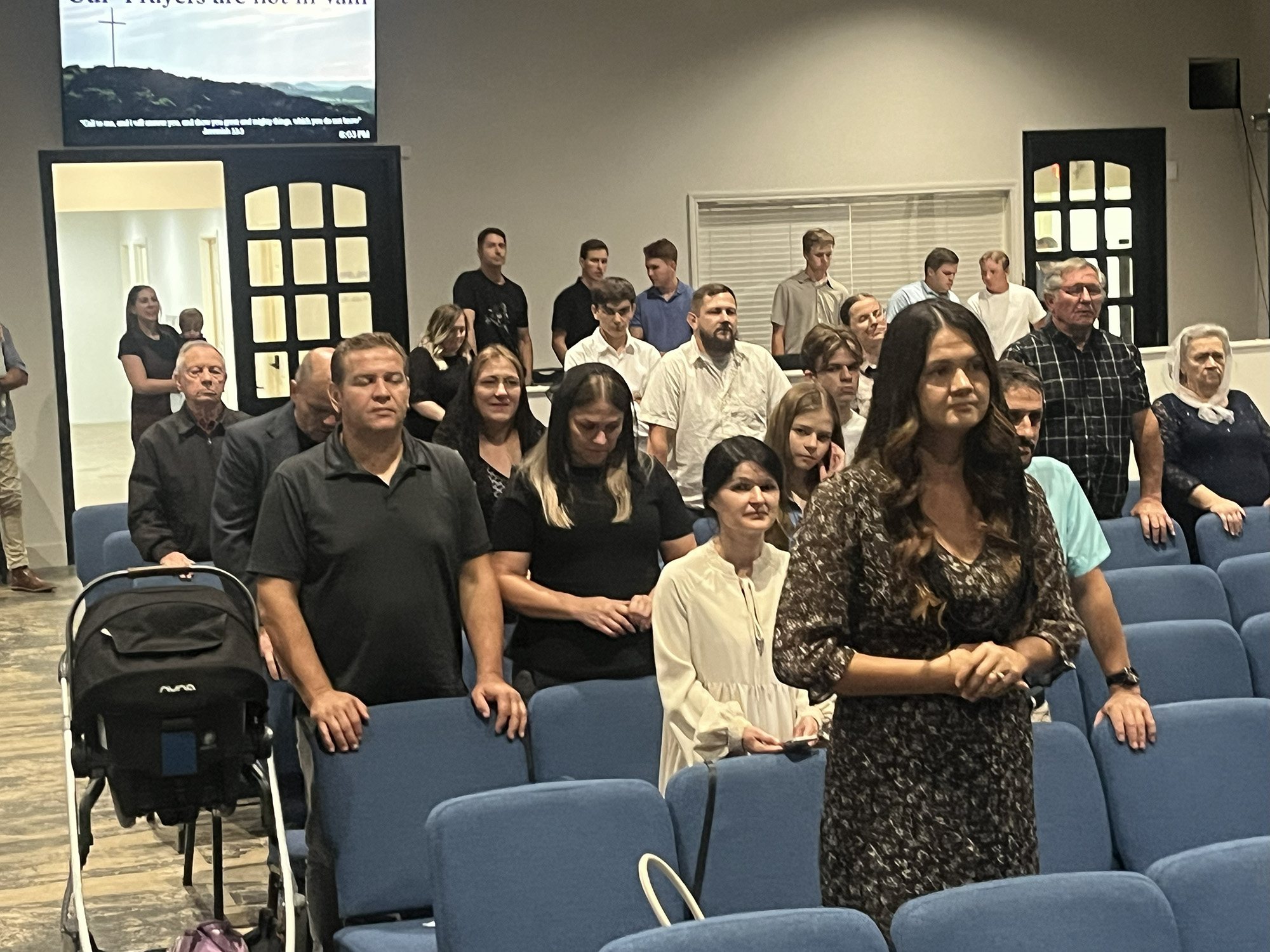 Attendees listen while Pastor Ruben explains 10 Days of Prayer