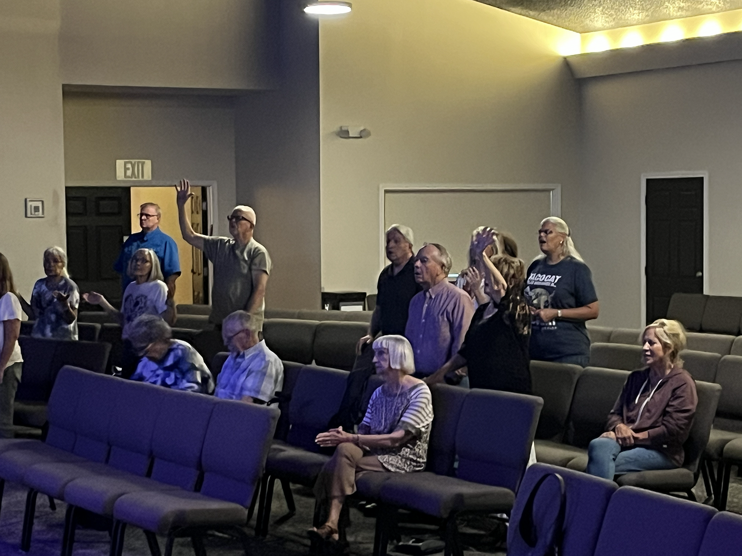 Attendees join in worshipful song