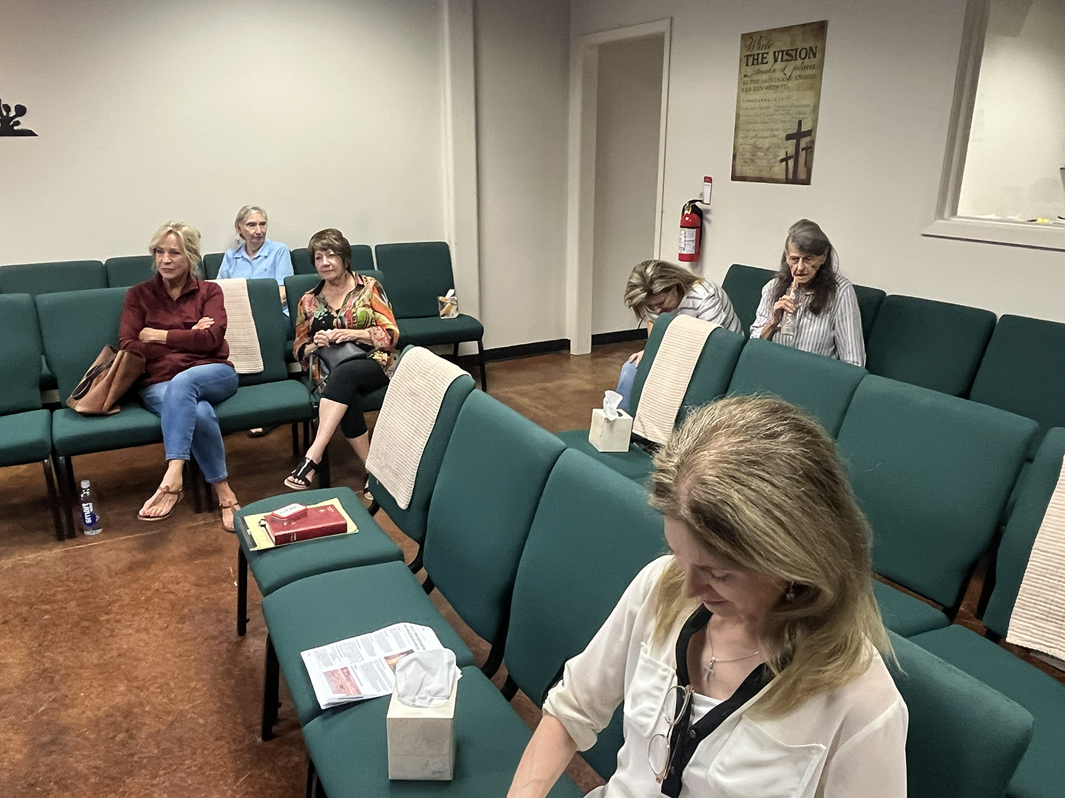 Attendees listen as Pastor Paul relates his church's story