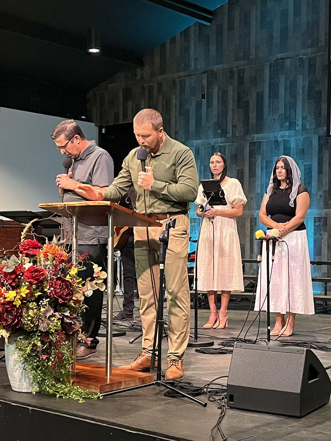 God Will Provide leaders open in prayer in Russian with English translation