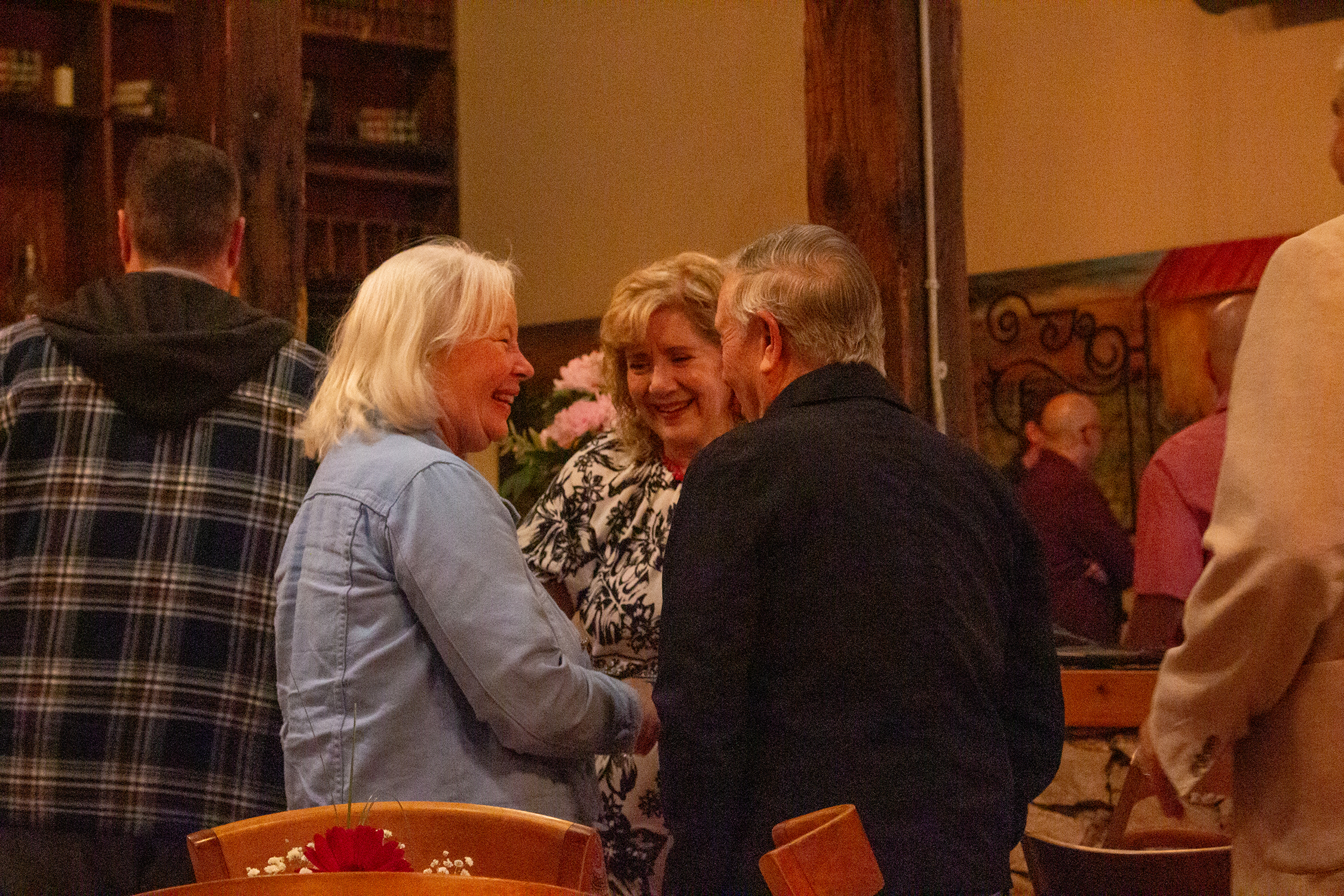 People mingle before the breakfast begins