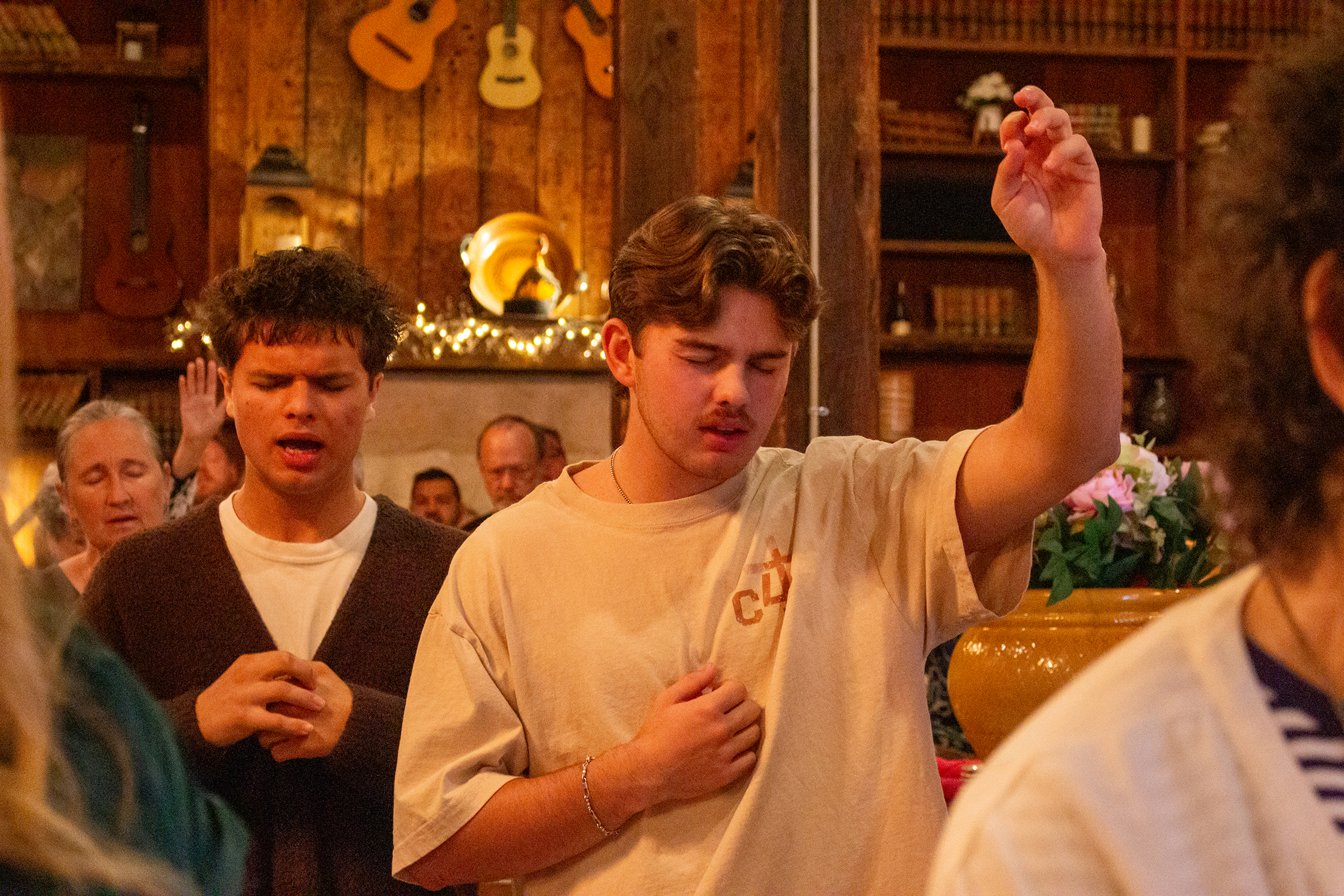 Youth leaders Adeen Pop (C4C) and Tristan Onweller (C4C) join in praiseful worship