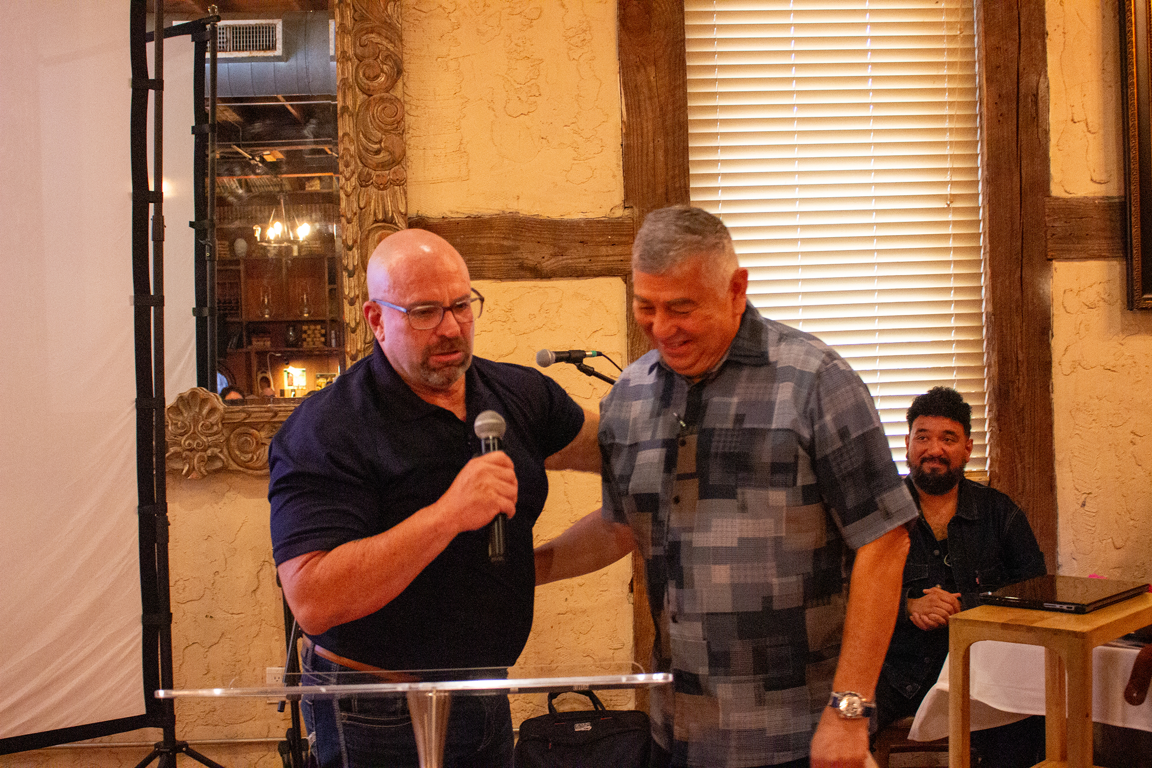 Will Smith hands off to Pastor Ruben Mendez for the final benediction